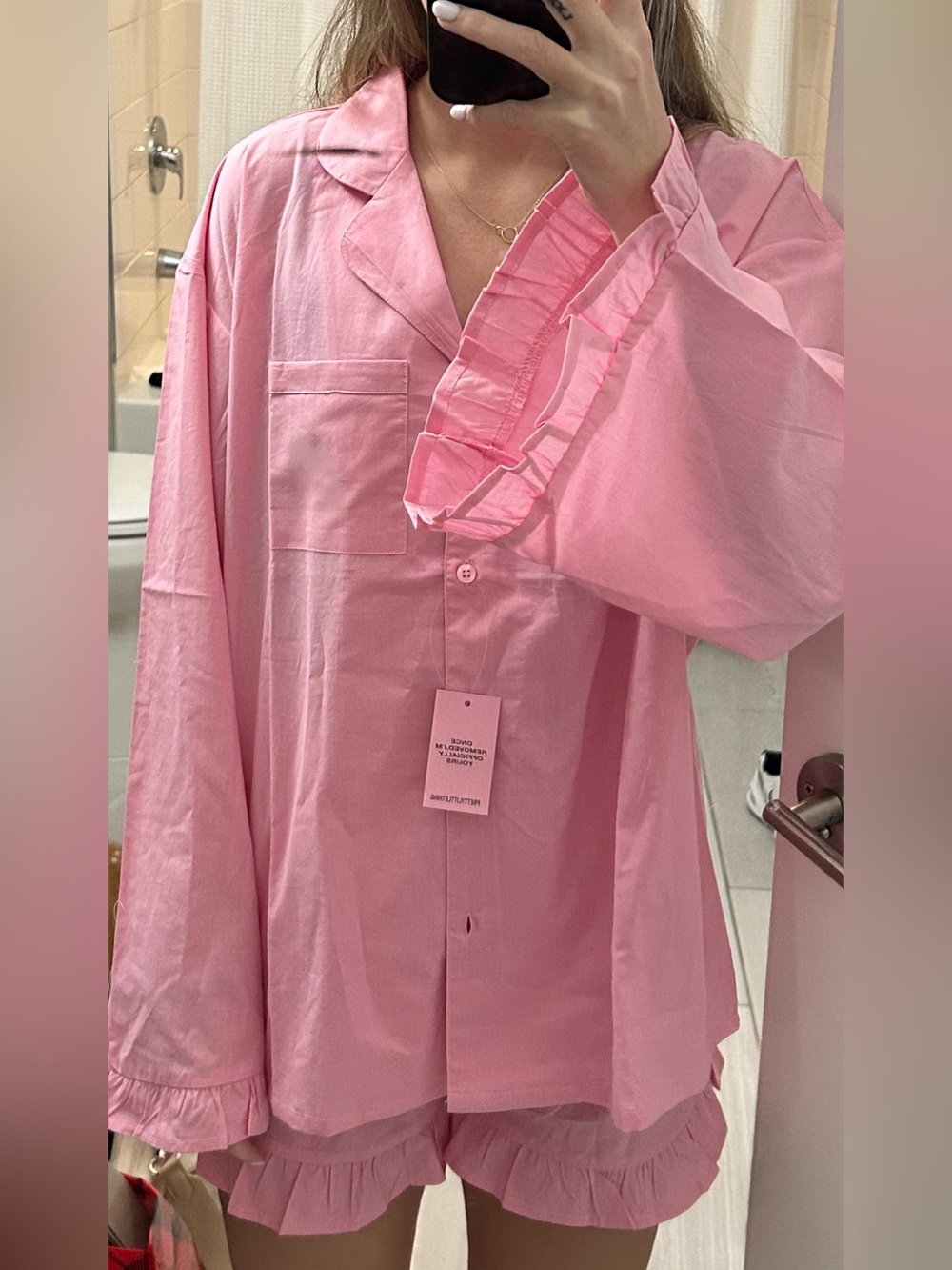 9 pairs of PrettyLittleThing Pink Ruffle-Trim Button Pajama Sets. NTW